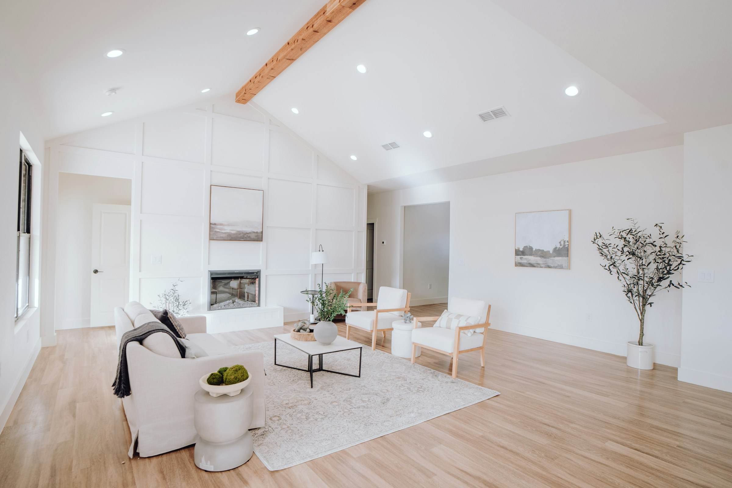 An open-plan living room with oak floors running through to the kitchen